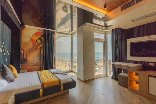 Postel nebo postele na pokoji v ubytování Vila One Beach Hotel