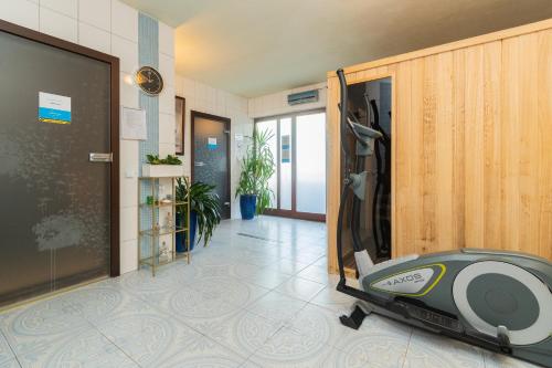 a hospital hallway with a door open to a room at Lazurowy Dwór - Przystań Latarnika Grand Apartments in Sztutowo