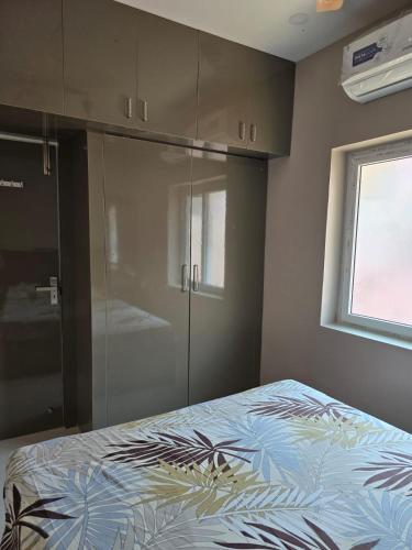 Katil atau katil-katil dalam bilik di HOME STAY In TNAGAR E14