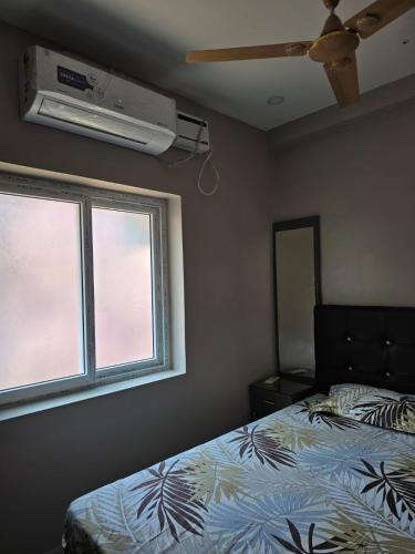 Katil atau katil-katil dalam bilik di HOME STAY In TNAGAR E14
