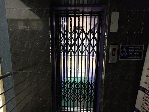 a door with a gate in a building at Sea Sand Digha in Digha