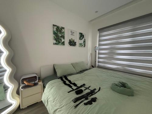 Ένα ή περισσότερα κρεβάτια σε δωμάτιο στο Love homestay with toys - Homioh homestay