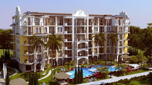 a large building with a pool in front of it at Nice 2 Room Apartment Harmony Suites 3 Sunnybeach in Sunny Beach