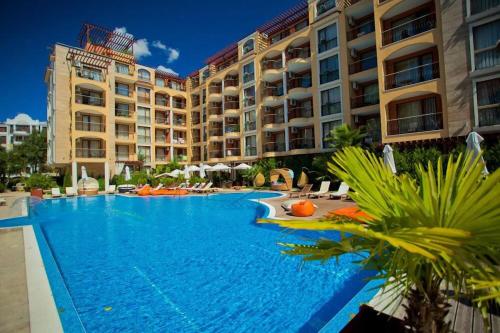 a large swimming pool in front of a hotel at Nice 2 Room Apartment Harmony Suites 3 Sunnybeach in Sunny Beach
