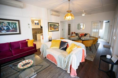 a living room with a couch and a table at The Carrington Manor in Brisbane