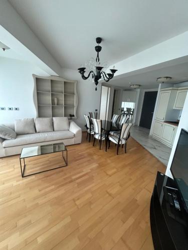 a living room with a couch and a table at Apartments Krug in Budva