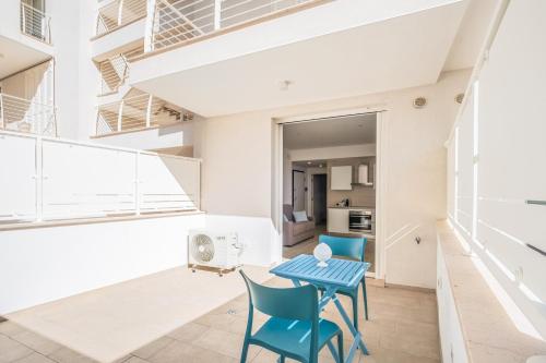 a room with a table and chairs in a building at Dimora Idrusa in Otranto