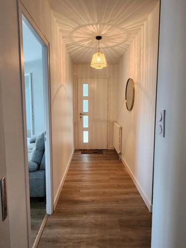 a hallway leading to a room with a ceiling at La maison des étoiles in Chazé-Henry