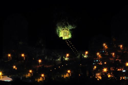 a lit up building at night with street lights at Yeniceri City Hotel in Fethiye
