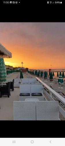 a view of a beach with chairs and umbrellas at Casa Anna in Francavilla al Mare