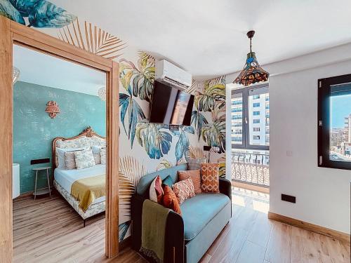 Ένα ή περισσότερα κρεβάτια σε δωμάτιο στο Alhambra Dèco Homtels