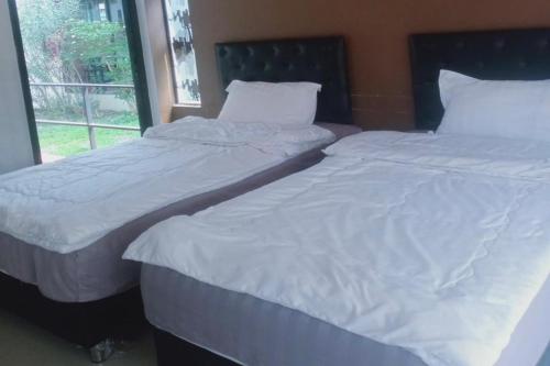 Postel nebo postele na pokoji v ubytování Phra Chan Khiang Dao Resort