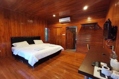 Postel nebo postele na pokoji v ubytování Phra Chan Khiang Dao Resort