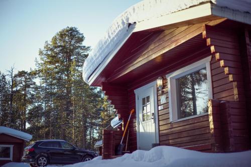 a house with a window on the side of it at Crow Creek Cabins in Inari