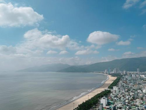a view of a beach with buildings and the ocean at TMS Quy Nhơn - Hupa Apartment View Biển in Quy Nhon