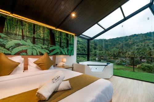 a bedroom with a bed and a large window at The Blackberry Retreat Kandy in Kandy