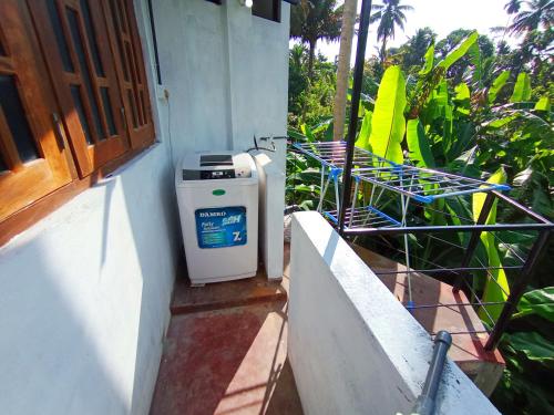 a heater sitting on a porch next to a building at Bluebell Villa Mirissa in Kamburugamuwa