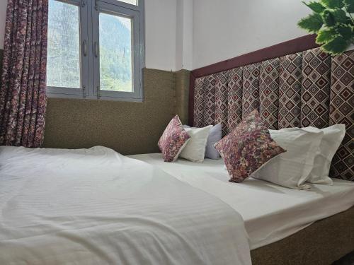 Postel nebo postele na pokoji v ubytování Resort Apple Flower Heritage