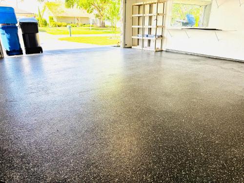a garage with a concrete floor in front of a door at Tampa Luxury 5BR Estate with Pool and Golf Views in Tampa