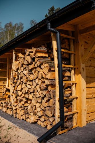 a pile of wood in the side of a building at Willa Aleksandria in Grabie