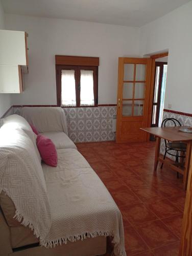 a living room with a couch and a table at Tío Abraham in El Raso