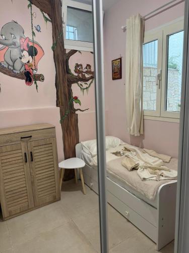 Ένα ή περισσότερα κρεβάτια σε δωμάτιο στο Evas home