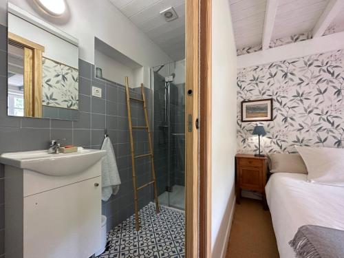 a small bathroom with a sink and a shower at Apartamentos rurales AGIÑAGA in Irún