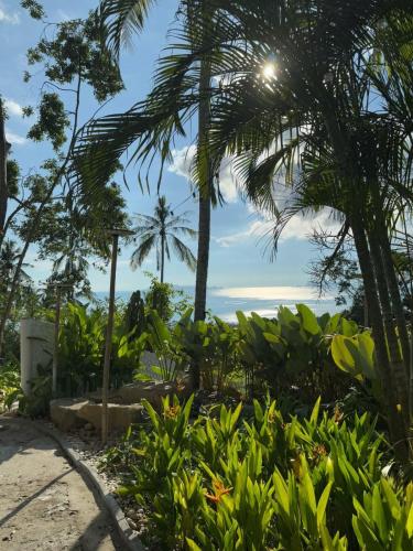 a view of the beach from the resort at RoomQuest THEVA Resort Koh Samui in Koh Samui 