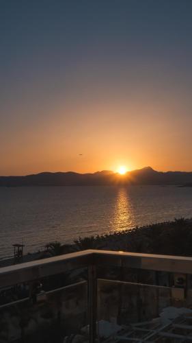 a sunset from the balcony of a condo at Hotel Playa Golf - Adults Only in Playa de Palma