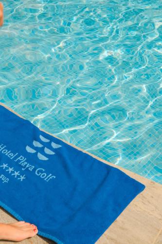 a blue yoga mat in a swimming pool at Hotel Playa Golf - Adults Only in Playa de Palma