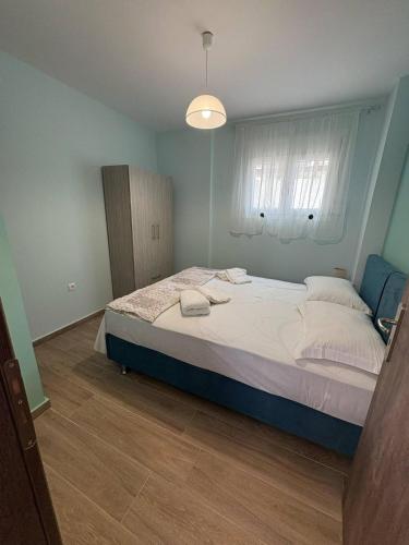 a bedroom with a large bed in a room at Nikiana Family Apartment in Nikiana
