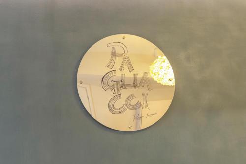 a mirror on a wall with writing on it at Opera Relais De Charme - Aparthotel in Verona