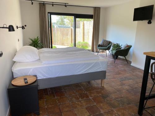 Postel nebo postele na pokoji v ubytování Bed & Breakfast Zeeland