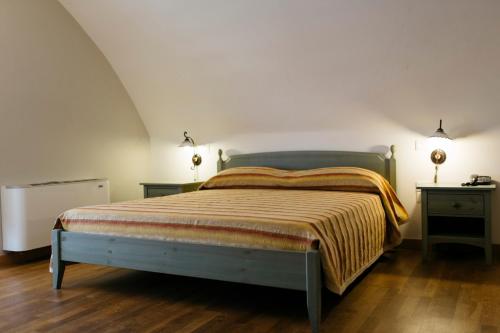 Tempat tidur dalam kamar di Residence Del Casalnuovo