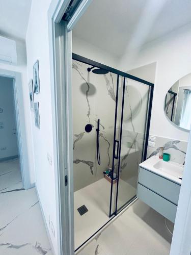 a bathroom with a shower with a glass door at Vista mare in Vasto