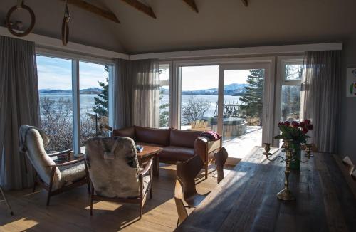 a living room with a couch and a table at Thingvellir Chateau in Selfoss