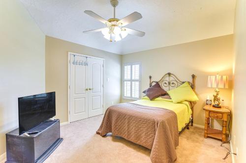 a bedroom with a bed and a flat screen tv at Patio, BBQ and Yard Family Retreat in Pearland in Pearland