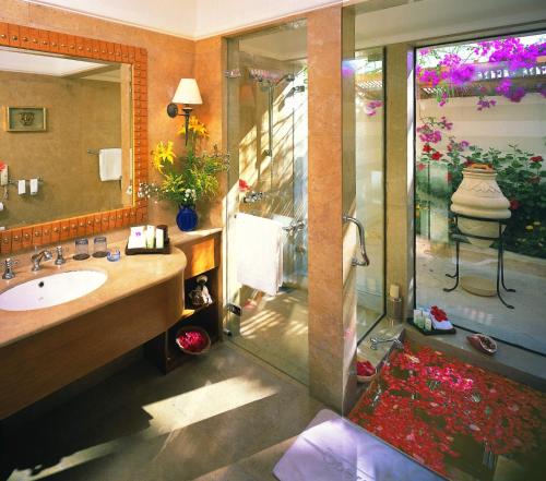 a bathroom with a sink and a shower at The Oberoi Beach Resort, Sahl Hasheesh in Hurghada