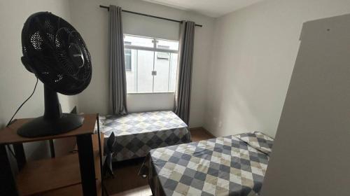 En eller flere senge i et værelse på Santa Branca Easy Stay 01