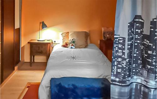 a hotel room with a bed with a city skyline at Beautiful Home In Charritte-De-Bas in Charritte-de-Bas