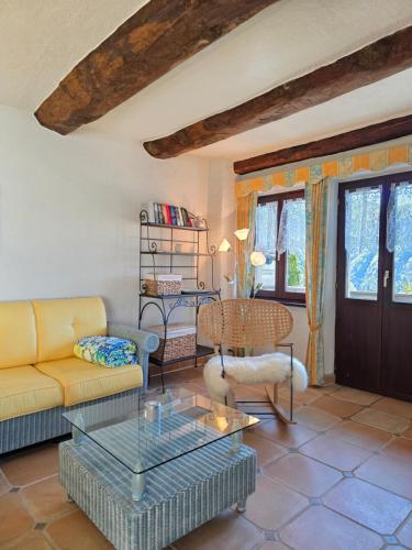 a living room with a couch and a table at Casa Carina - Enchanted rustico in Mergoscia in Mergoscia