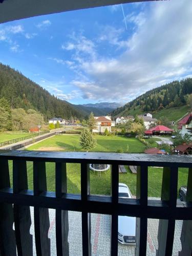 a view from a balcony with a view of a valley at Regina Munților Spa&Confort in Moieciu de Sus