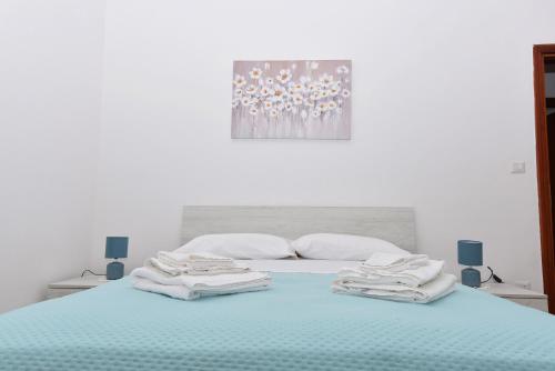 Ένα ή περισσότερα κρεβάτια σε δωμάτιο στο La Terrazza sugli Dei