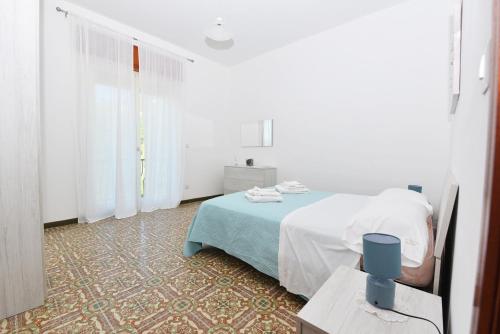 Ένα ή περισσότερα κρεβάτια σε δωμάτιο στο La Terrazza sugli Dei