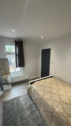 a bedroom with a large bed and a window at Abena' Villa in Moffat