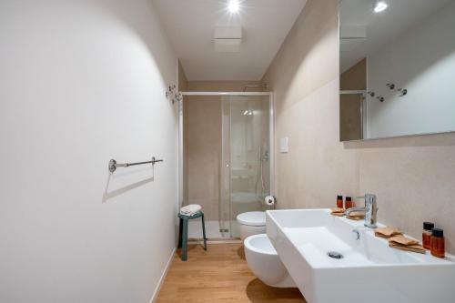 a bathroom with a white sink and a toilet at Sogno di Mare in Bari