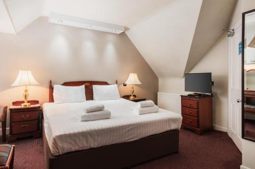 Cama o camas de una habitación en Kyle Hotel ‘A Bespoke Hotel’