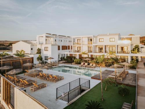 an aerial view of a building with a swimming pool at Shambhala Fuerteventura in Parque Holandes