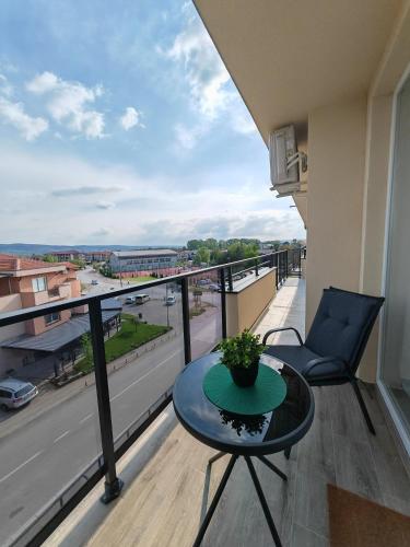 a balcony with a table and a view of a city at Zenith in Veliko Gradište