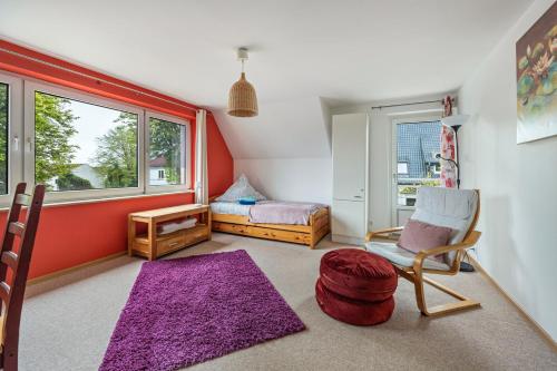 a room with a chair and a bed and a window at Bad day good day in Horn-Bad Meinberg